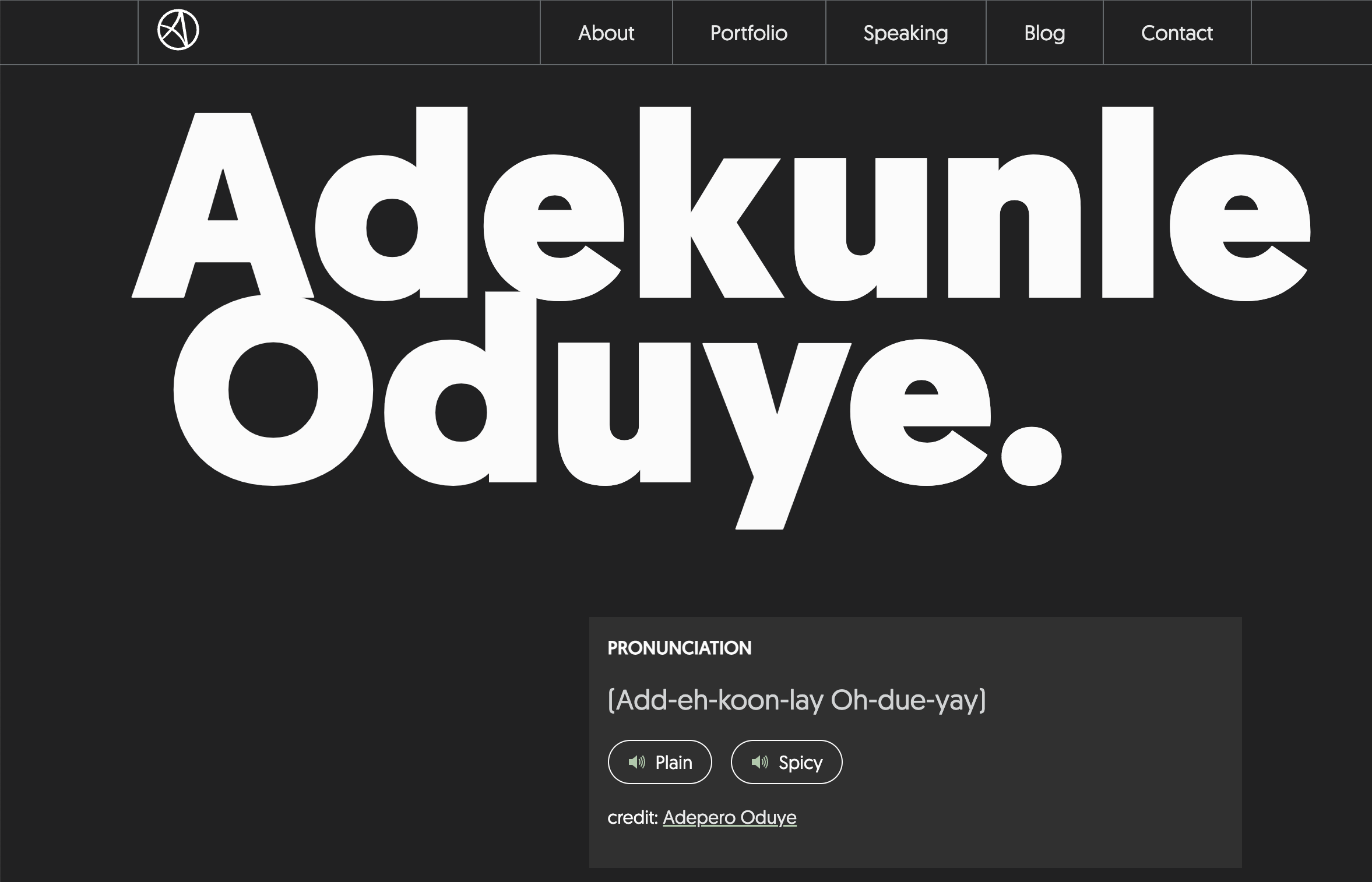 Huge white sans-serif type spells out, 'Adenkunle Oduye.' The name sticks starkly out from a black background and a mininal design. Below the name is a small pronounciation guide that reads, 'Add-eh-koon-lay Oh-due-yay.' There are two buttons present after the pronounciation, one offering a plain audio pronounciation and one offering a spicy audio pronounciation. Screenshot.